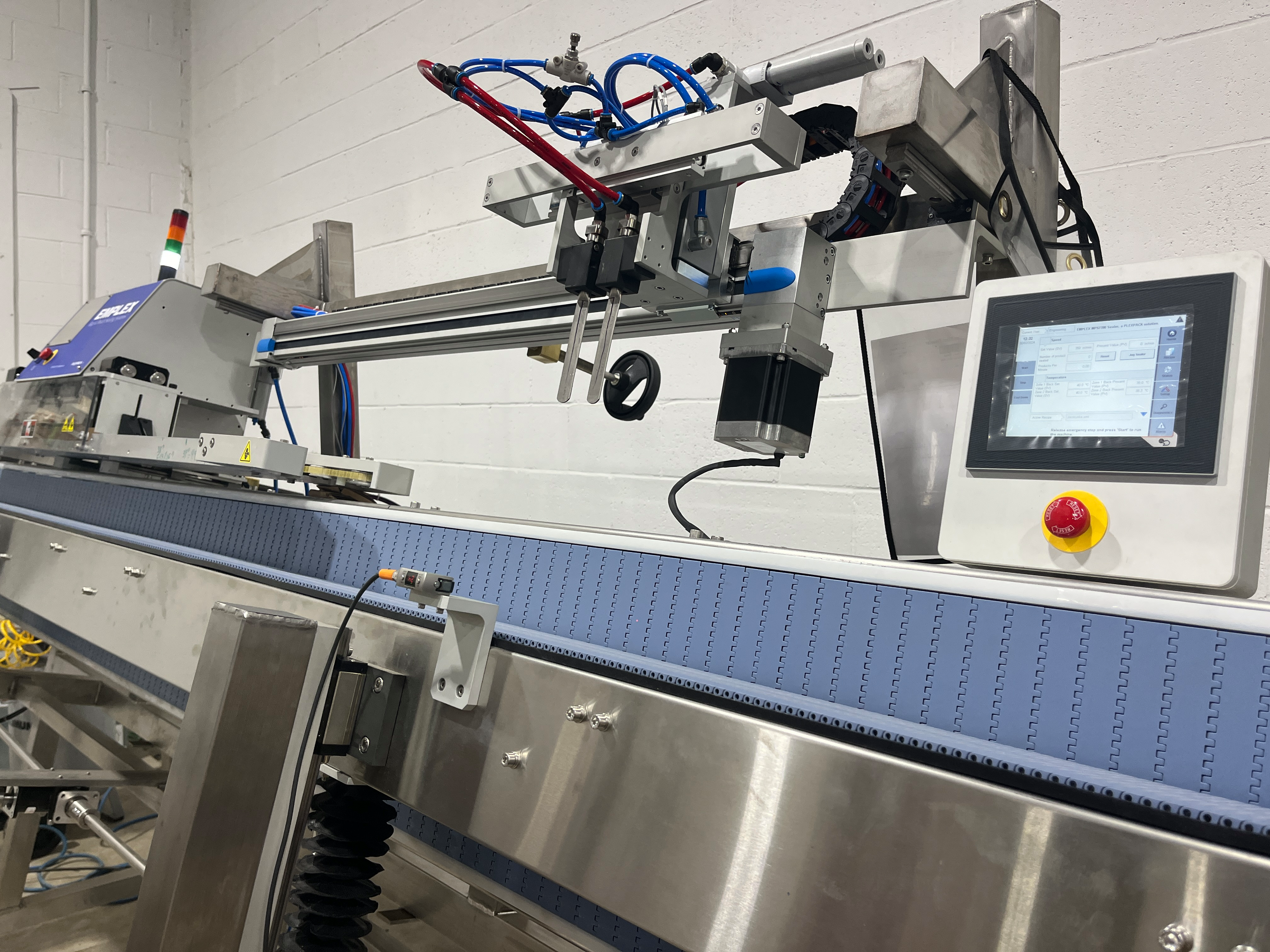 Emplex MPS Series robotic pick-and-place arm and touchscreen control on the production floor